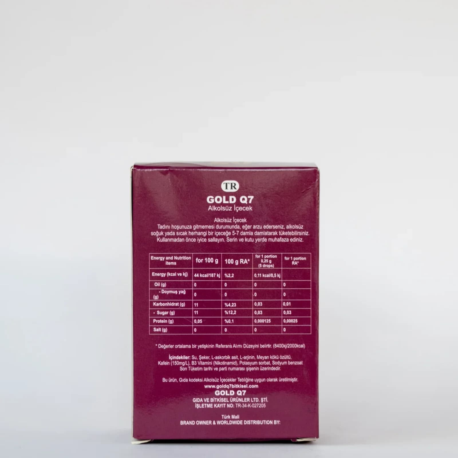 Q7 Gold Drops for Women, strawberry essence, bottle, angled view, label visible